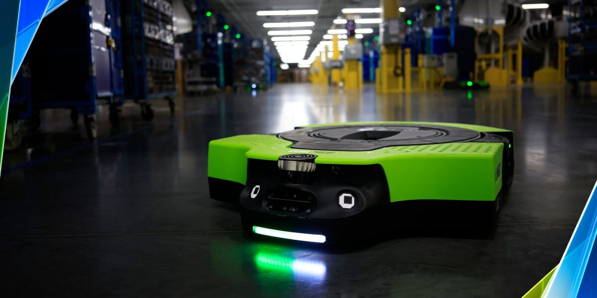 Amazon Proteus autonomous AI warehouse robot moving carts in fulfillment center