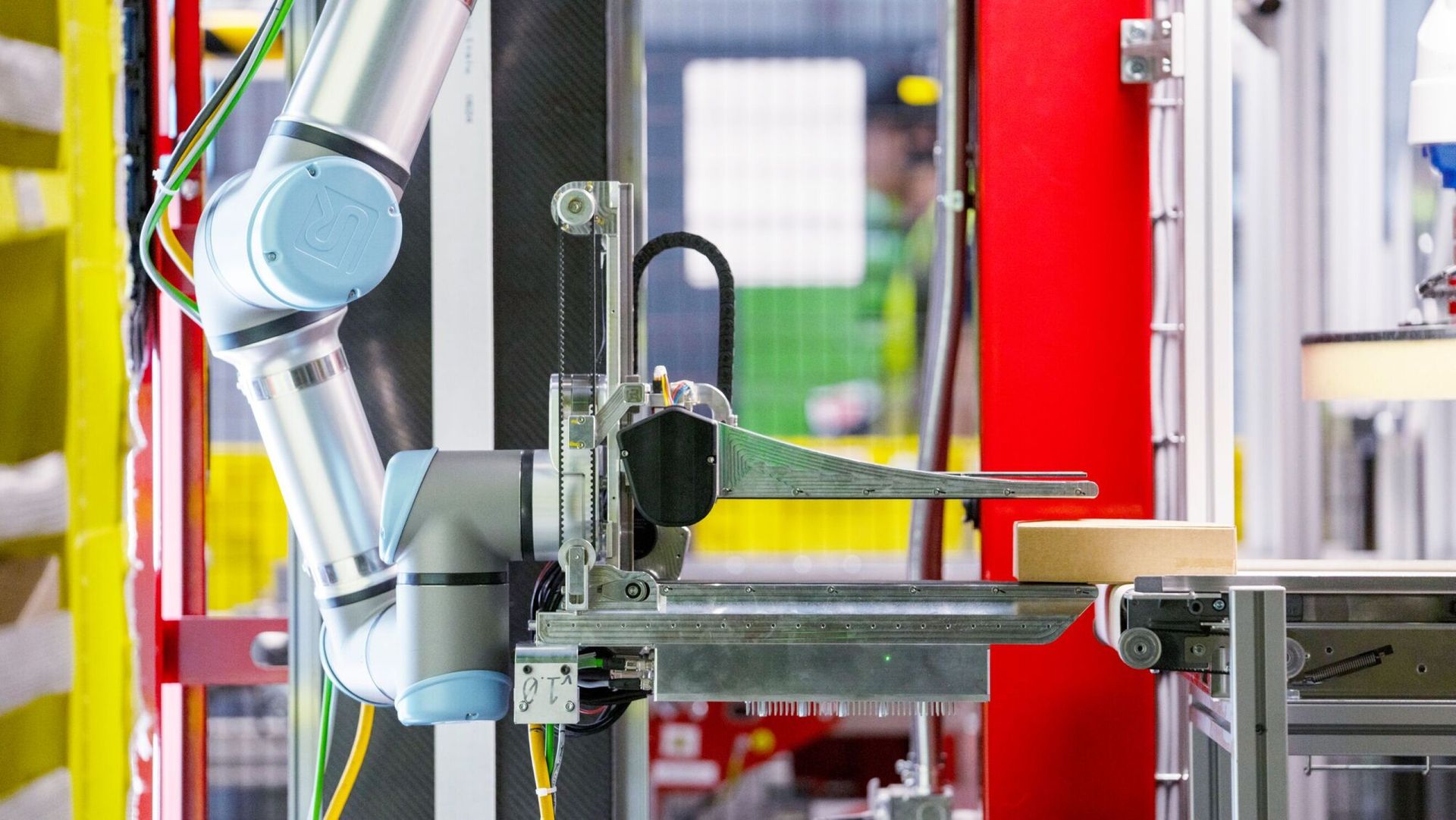 Amazon Vulcan robot using force sensors and sense of touch to pick items from storage pods