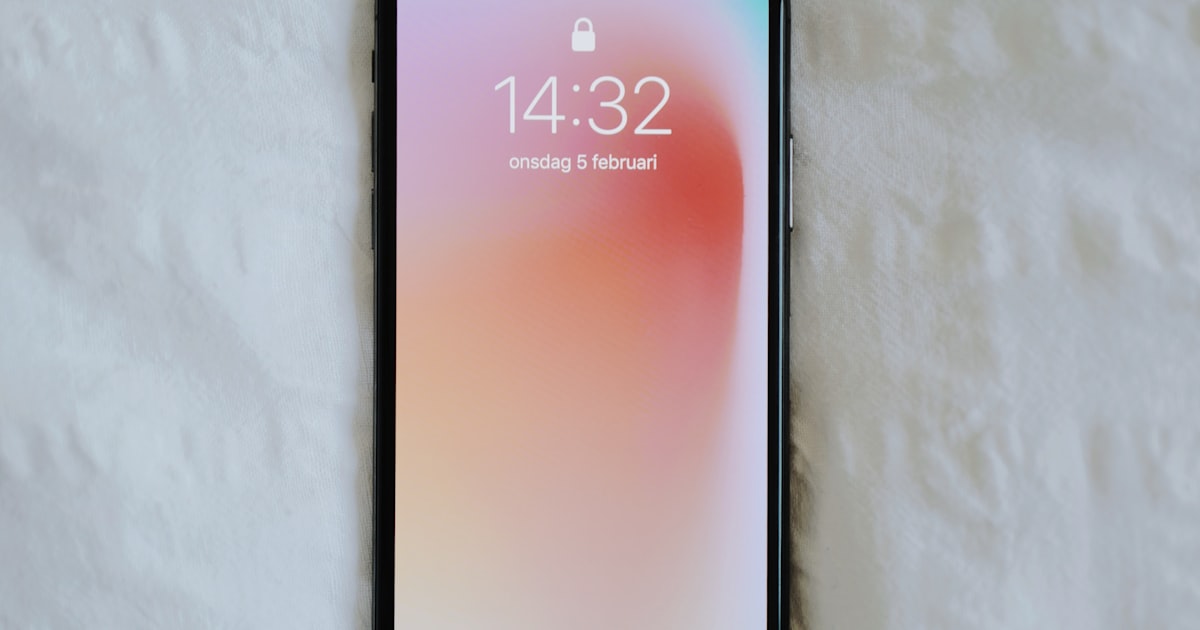Hand holding a foldable smartphone opened to reveal a large tablet-sized display
