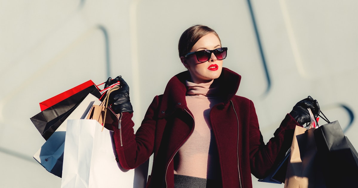 Shopper using a mobile phone to browse products on a shopping app