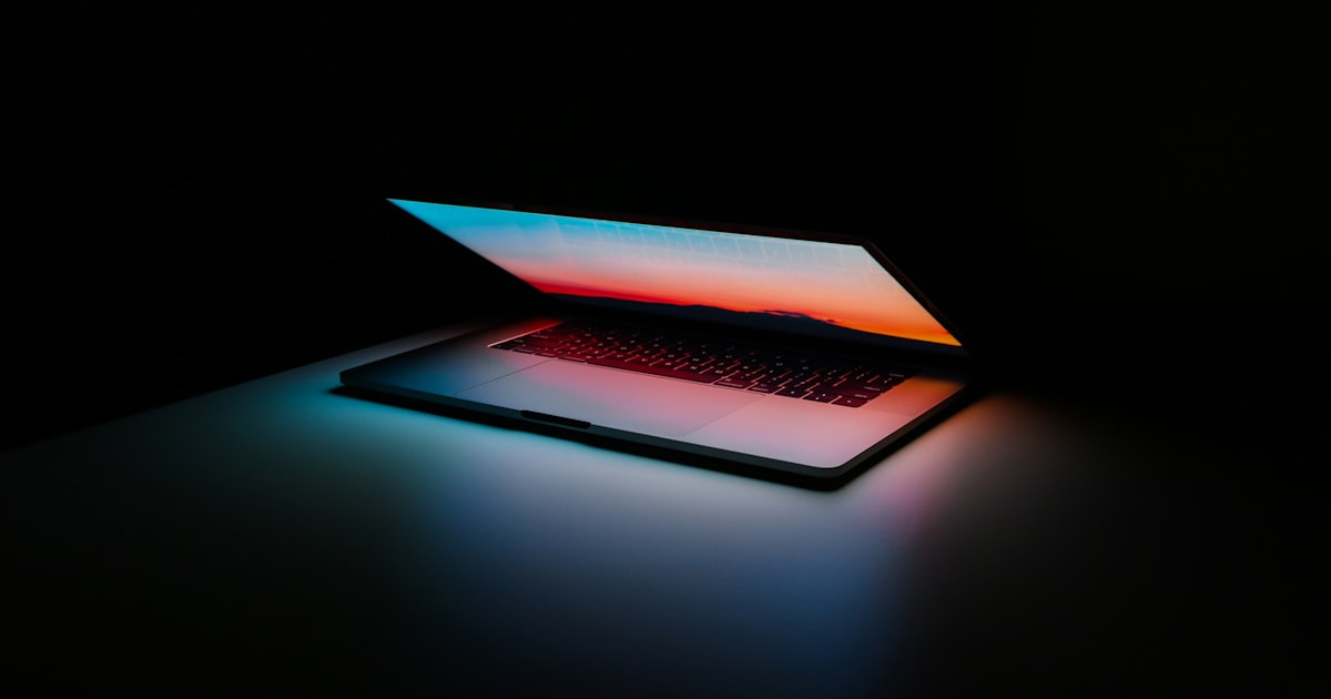 ChatGPT interface open on a laptop beside a coffee and notebook