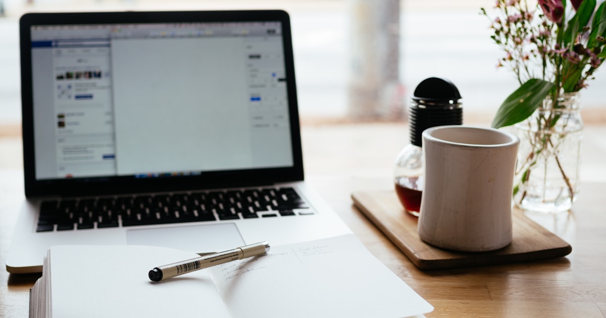Person editing a website template on a laptop