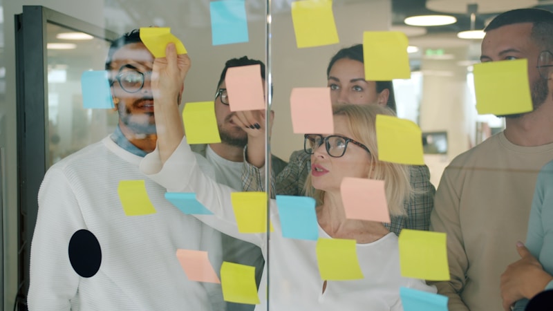 Team brainstorming with sticky notes - collaborative creativity session